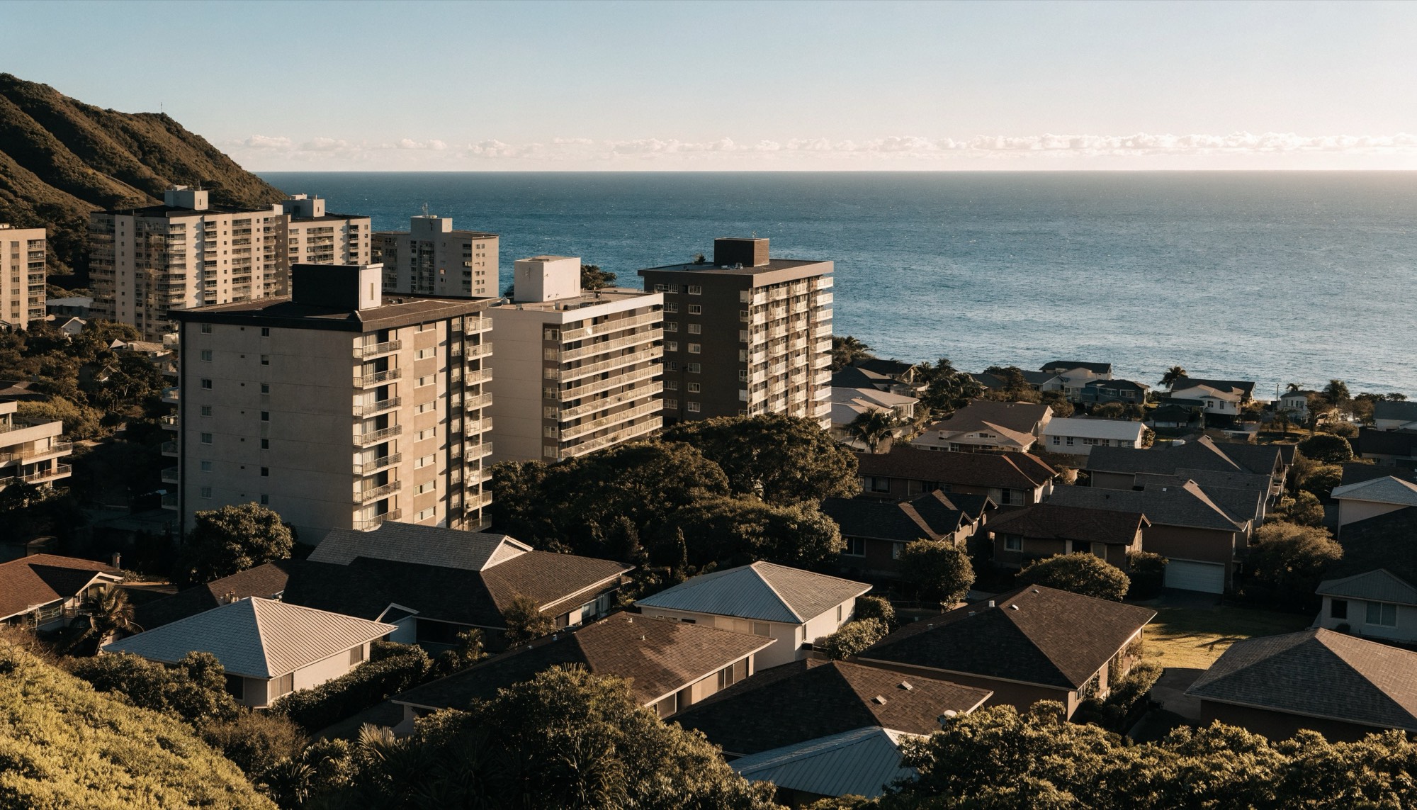 Honolulu residential neighborhood of condominium towers and single-family homes above the Pacific ocean.