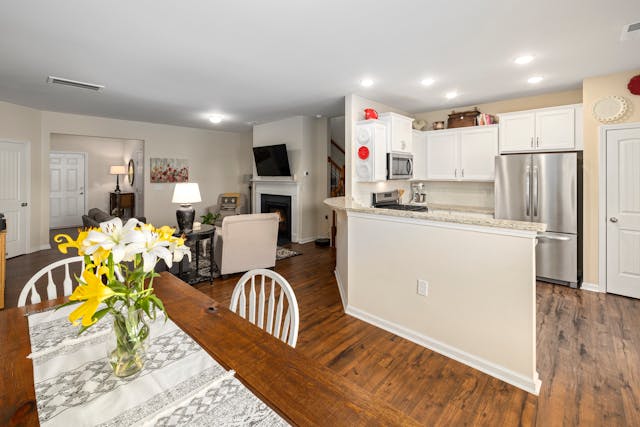 view-of-kitchen-and-dining-room-and-living-room-with-wood-floors